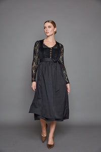 Ein traditioneller Traum in Schwarz! Unser Dirndl „München“ mit elegantem Samtmieder und knitterarmem Rock kann mit verschiedenen Schürzen und Blusen sehr abwechslungsreich kombiniert werden. 